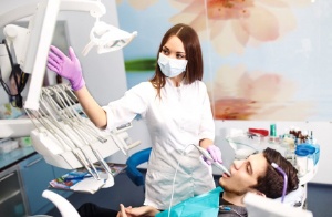 A dentist working with a patient.