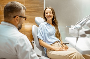 Dentist talking to patient about tooth-colored fillings