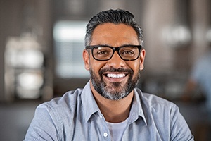 Man with dental implants in Gainesville smiling