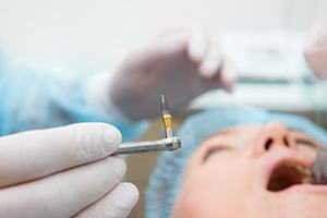 Dentist preparing to place dental implant