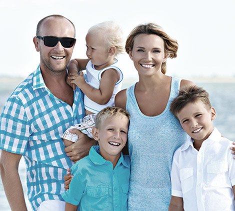 Mother father and three children at beach