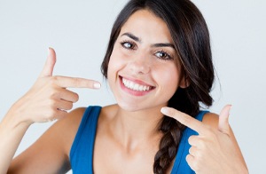 woman smiling pointing