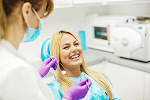 woman happy at dentist