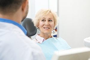 Older woman smiling in dental chair