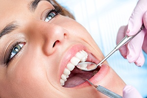 Closeup of patient receiving dental exam