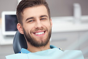 Smiling man in dental chair