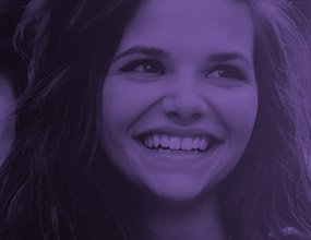 Woman with beautiful healthy smile highlighted purple