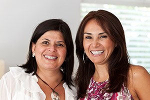 Two women smiling together