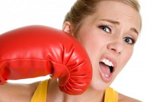 woman getting punched with boxing glove